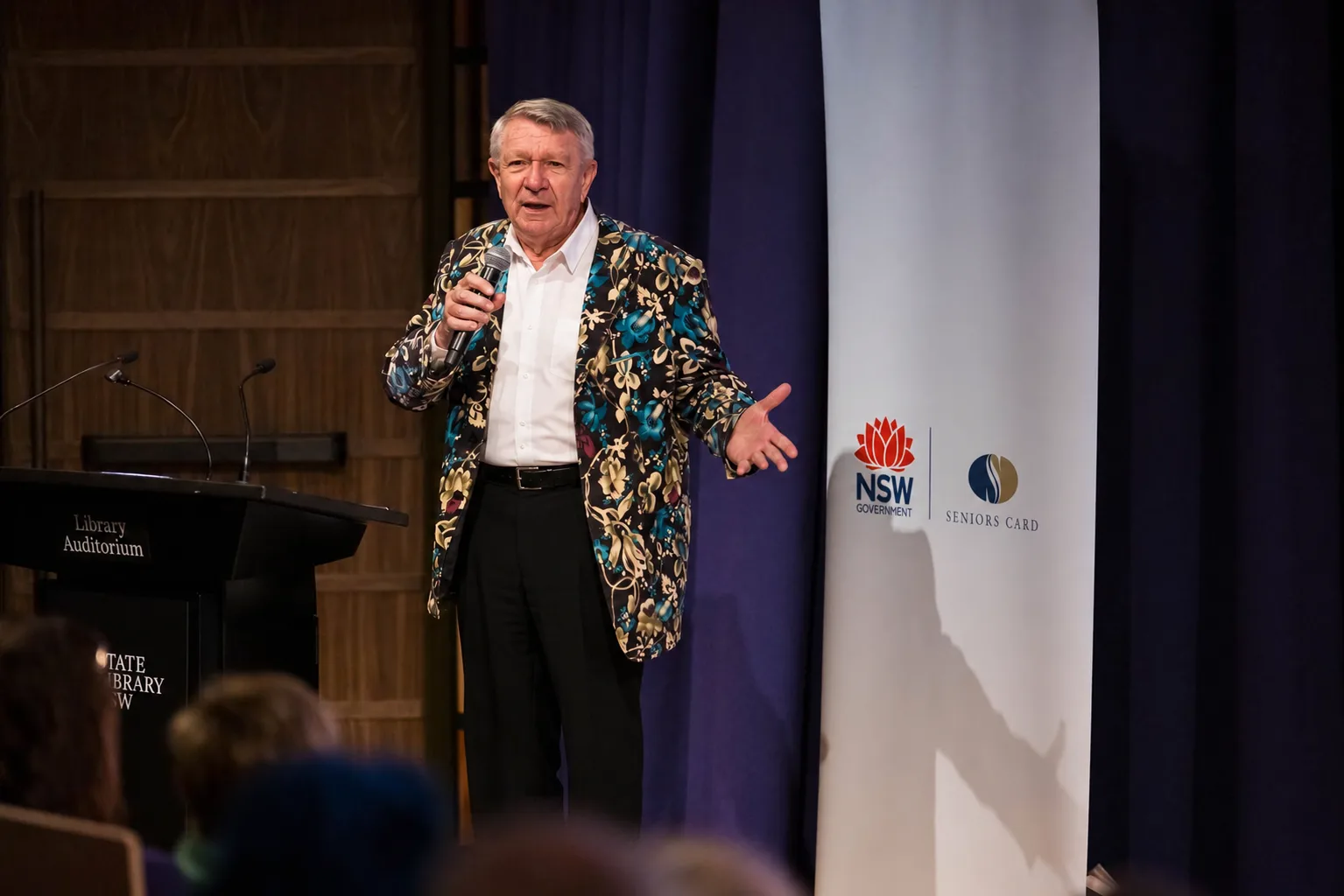 Jim Haynes speaking on stage